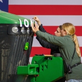 Staffers prep the event site