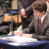 Justin Trudeau signing for Canada