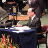 President of France Francois Hollande signing the treaty